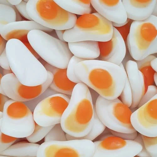 Realistic fried eggs lollies showing yellow yolk centre and clear white surround