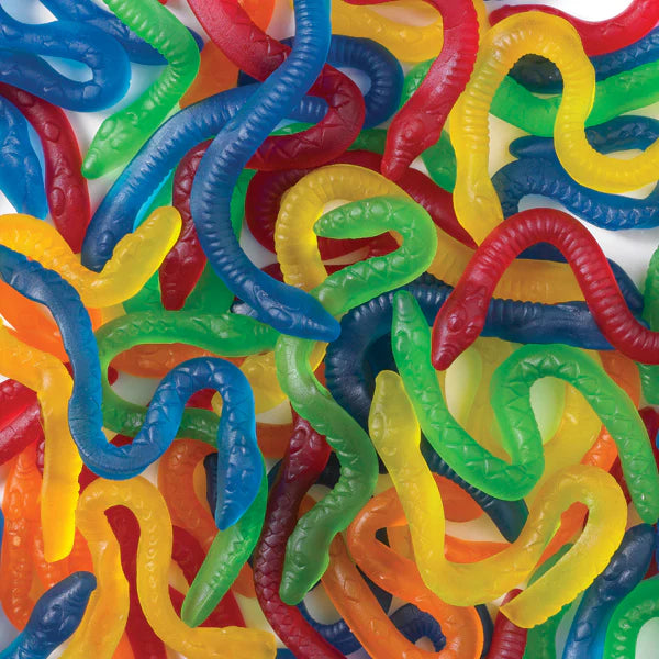 Colorful gummy snake candies in red, blue, green, yellow, and orange with detailed segmented textures, showing long serpentine shapes intertwined together