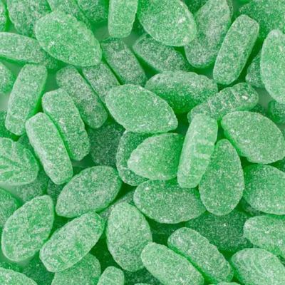 Close-up of green jelly beans on a green background