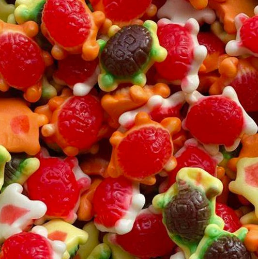 Assorted colorful gummy candies shaped like turtles and houses.